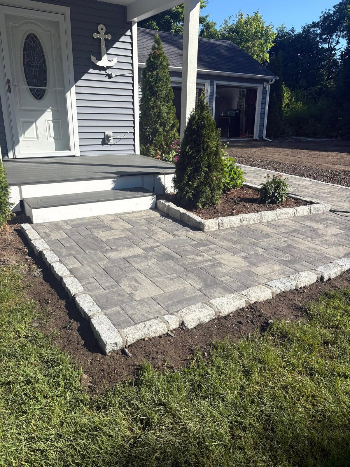 Paver landing and walkway with cobble edging